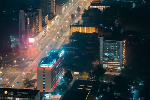 Night view of Addis Ababa looking down a lit main avenue toward the skyline
