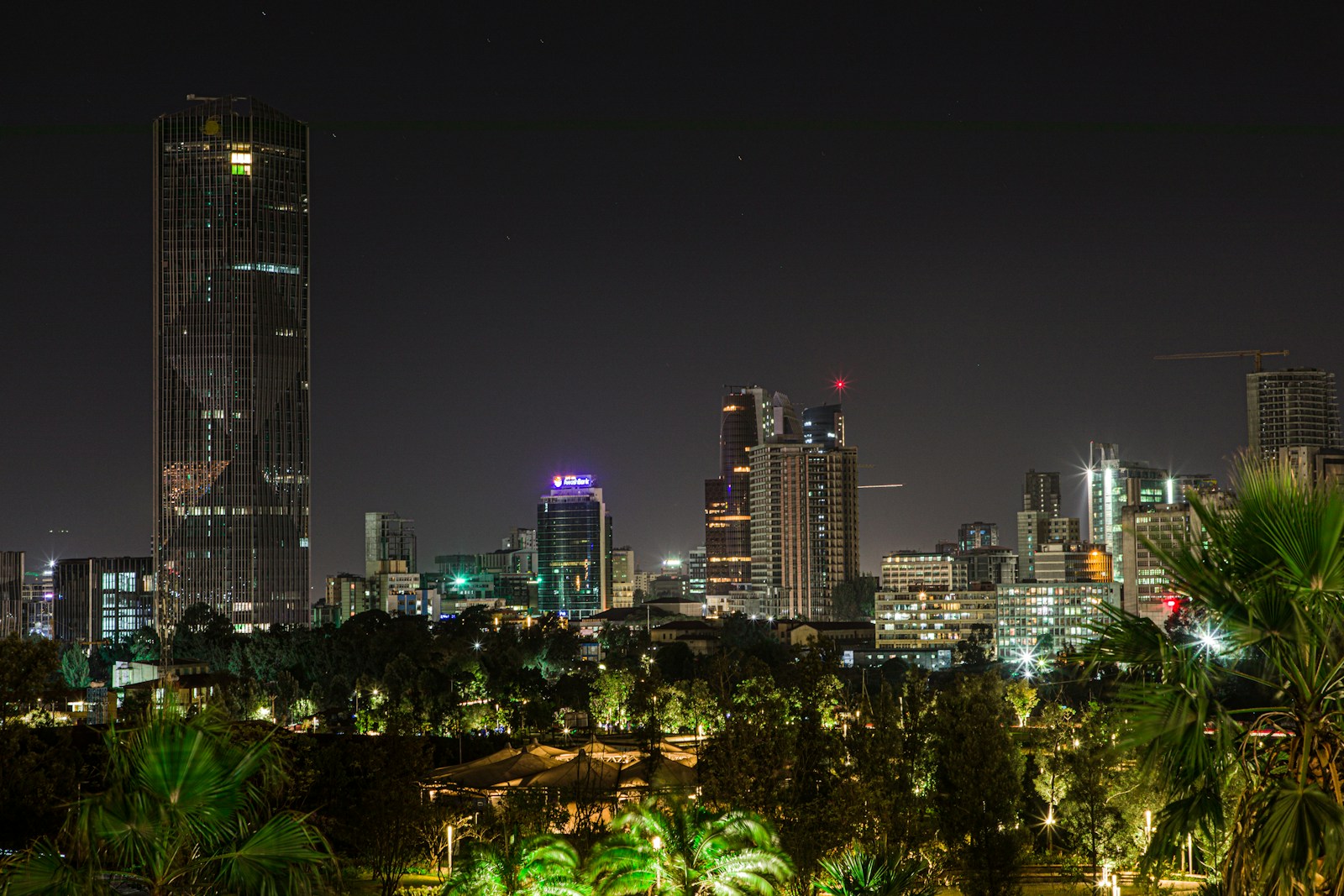 Aerial night view of the Addis Ababa skyline with high-rise towers