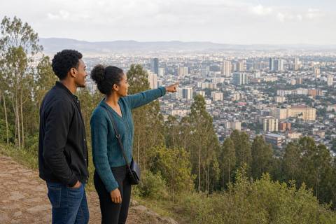 Two Ethiopian visitors looking across Addis Ababa from the Entoto hills